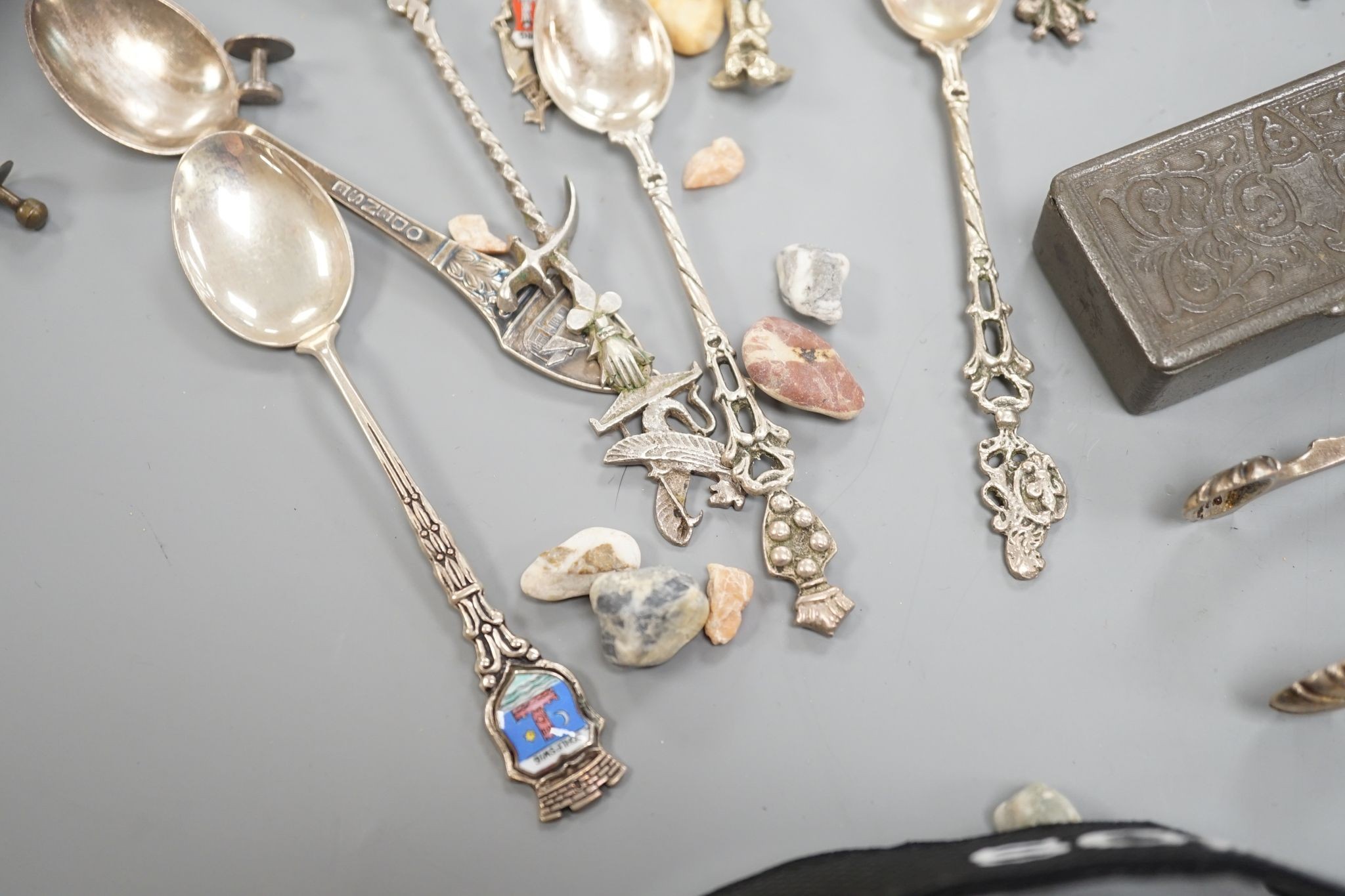 A Georg Jensen & Wendel A/S sterling small spoon, 10.2cm, a pair of antique silver sugar tongs(a.f.), a metal snuff box and a small group of minor spoons including continental white metal.